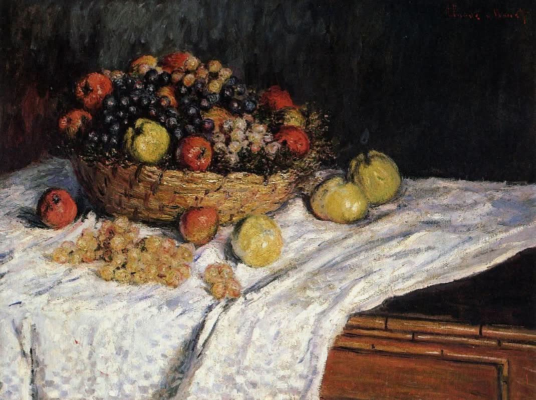 Obstkorb mit Äpfeln und Trauben