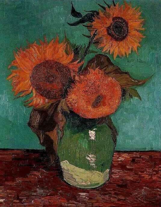 Drei Sonnenblumen in einer Vase